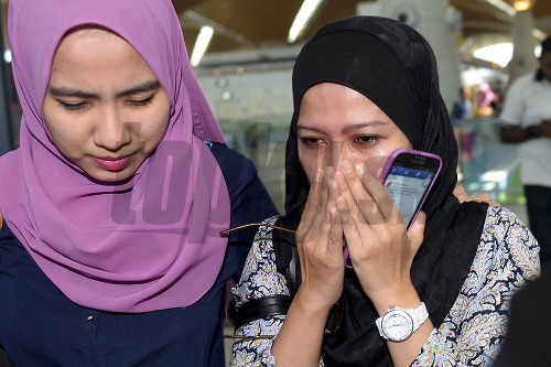Príbuzní obetí malajzijského letu