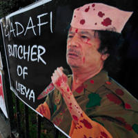 Plagát s Kaddáfim