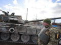 Ukrajinský vojak pred tankom