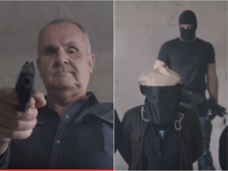 Jožo Ráž v novom klipe mieri zbraňou na novinára s vrecom na hlave po vzore Islamského štátu.