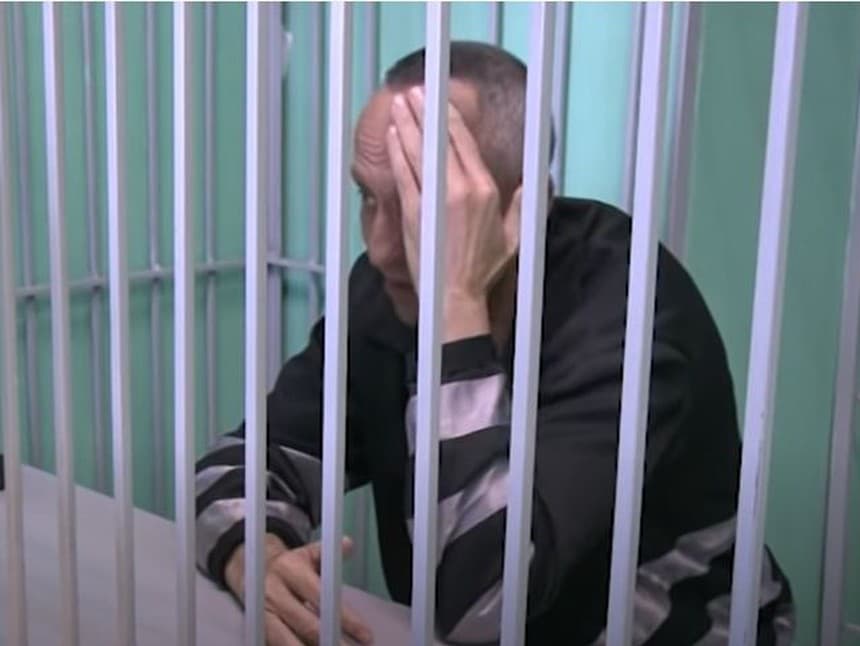 Michail Popkov v súdnej sieni.