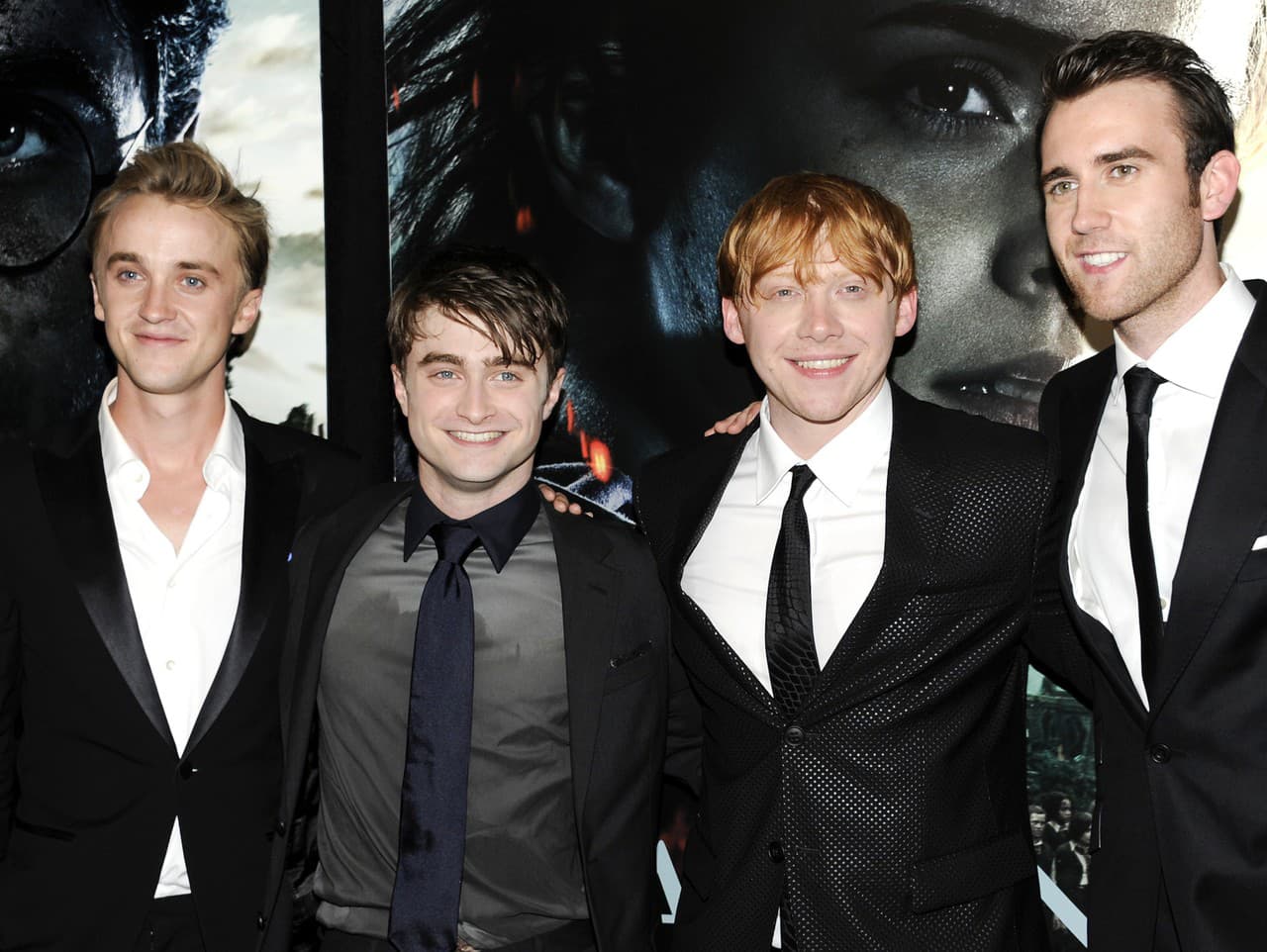 Tom Felton, Daniel Radcliffe, Rupert Grint a Matthew Lewis v roku 2011

