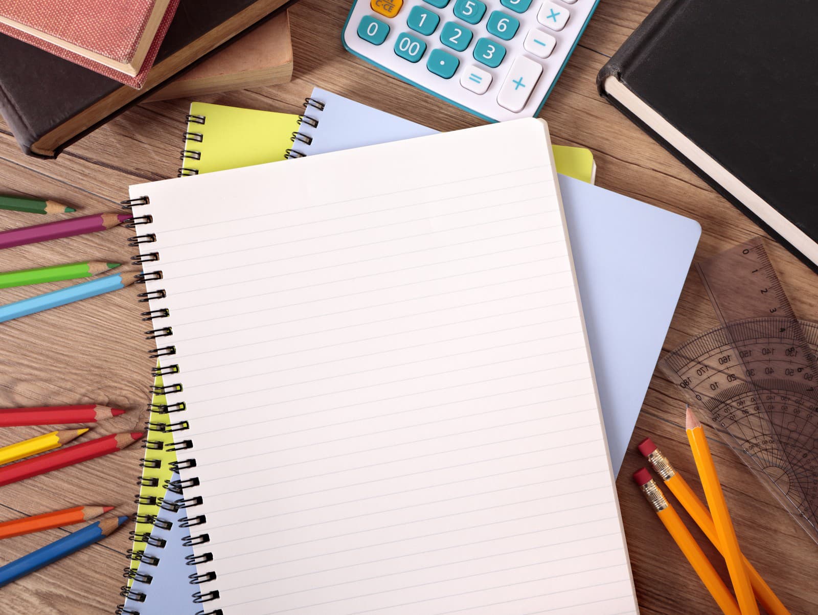 Untidy student's desk with blank book.  Alternative version shown below: