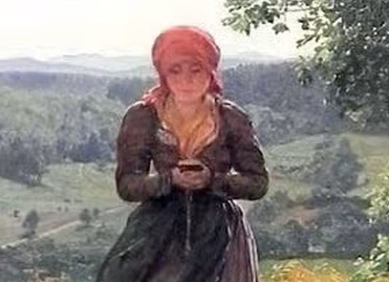Žena drží v rukách záhadný predmet.