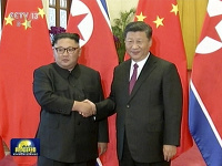 Stretnutie čínskeho prezidenta Si Ťin-pchinga a severokórejského vodcu Kim Čong-una. 