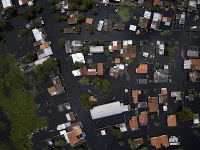 Na snímke zaplavené domy na predmestí paraguajskej metropoly Asunción Na snímke zaplavené domy na predmestí paraguajskej metropoly Asunción