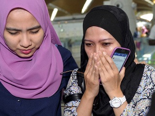 Príbuzní obetí malajzijského letu