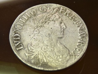 Strieborná minca s vyobrazením Ľudovíta XIV.