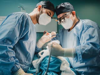 Medical doctors team operating