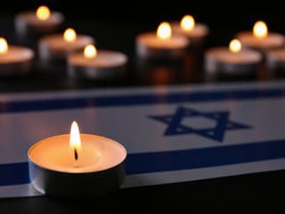 Burning candle and flag