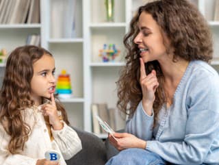 Speech therapy. Cute long-haired