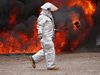 A firefighter carries an
