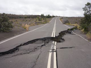 Asphalt road damaged by
