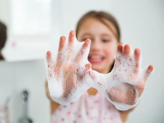 Little girl washing hands