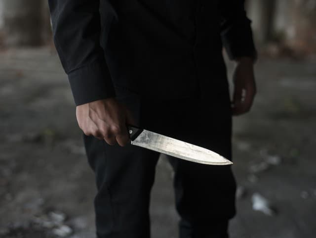 man holding knife in