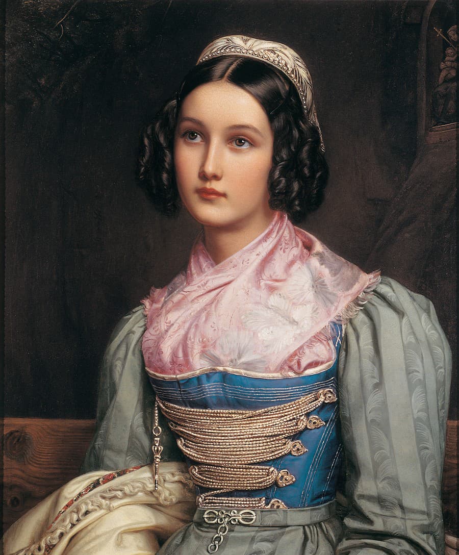 Krása Helene Sedlmayrovej (1813–1898), dcéry obuvníka, kráľovi učarovala, keď 15-ročné dievča doručovalo do paláca hračky pre panovníkove deti. Jej portrét v tradičnom mníchovskom kostýme je považovaný za jeden z najslávnejších v galérii.
