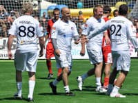 Hokejista Pavol Demitra - druhý zľava - sa raduje z gólu spolu s Marcelom Hossom - vľavo, Mariánom Hossom - druhý sprava- a Brankom Radivojevičom - vpravo - počas tretieho ročníka charitatívneho podujatia Hviezdy deťom organizovaného futbalovým klubom AS Trenčín. Trenčín, 25. jún 2011.