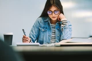 Woman student sitting at