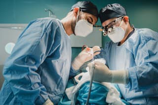 Medical doctors team operating