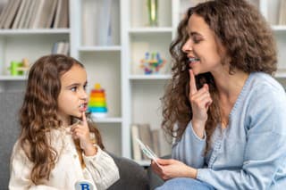 Speech therapy. Cute long-haired