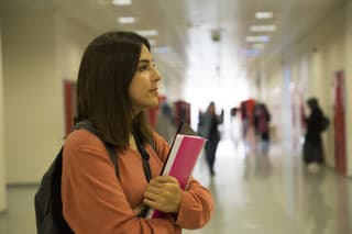 Beautiful female student standing